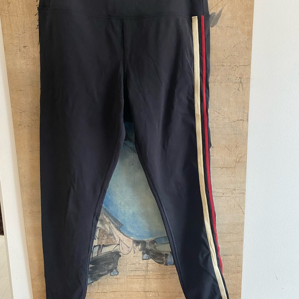 Pull on stretch leggings, black with Stripe on one leg detail